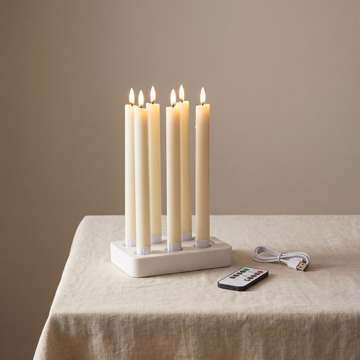 The full set: six taper candles in the charging base, with the remote control and USB-C cable