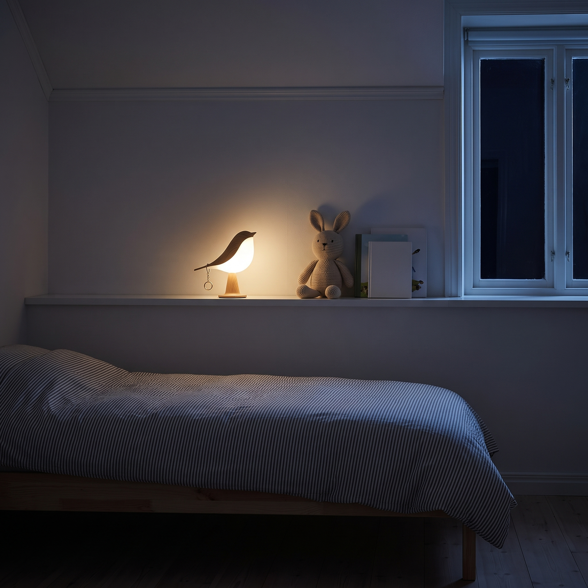Cora in light wood dimmed as a night light on a shelf in a child's bedroom